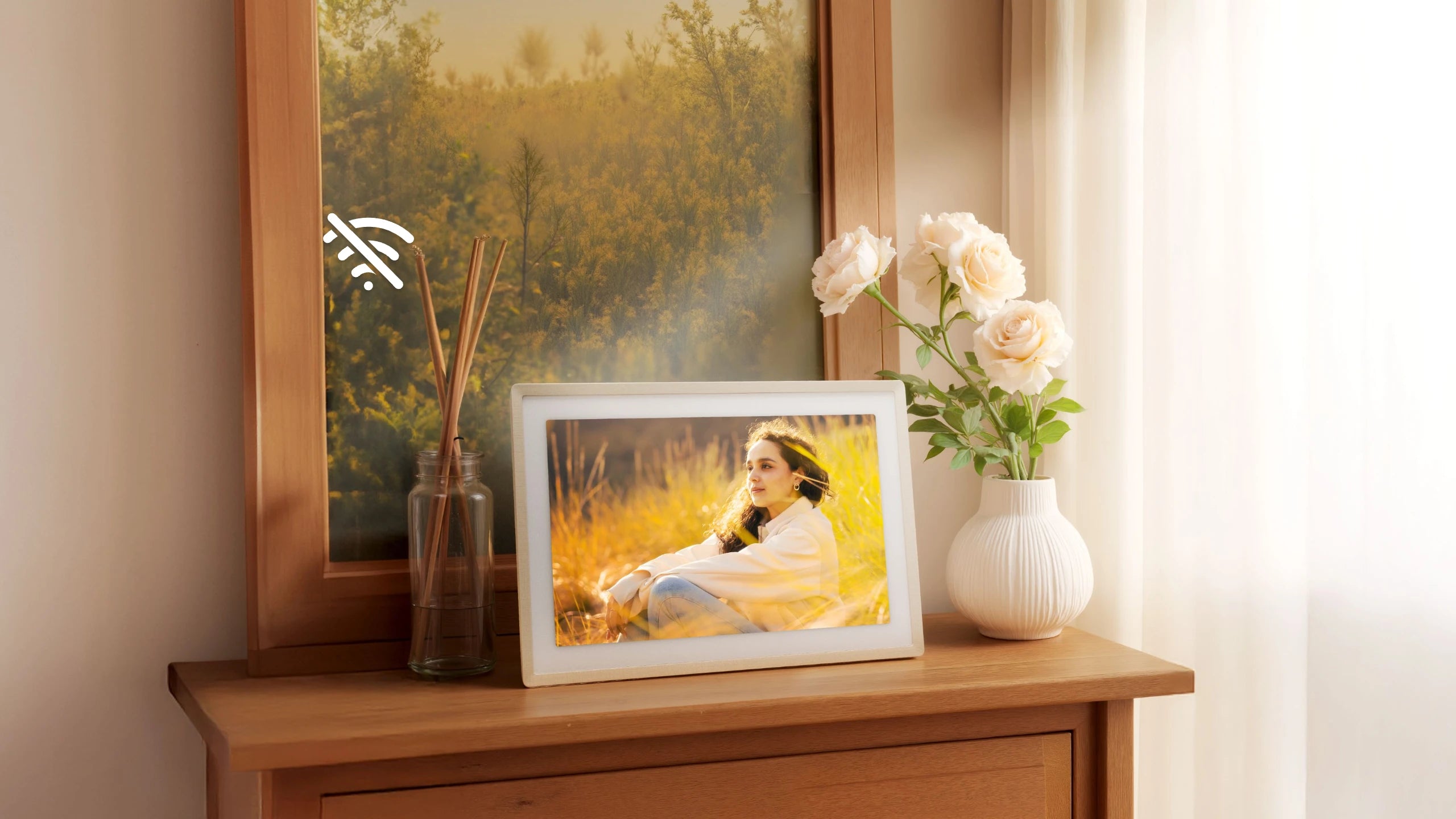 Sand 2K digital picture frame on a dresser displaying a woman in a golden field, with offline display that works without WiFi