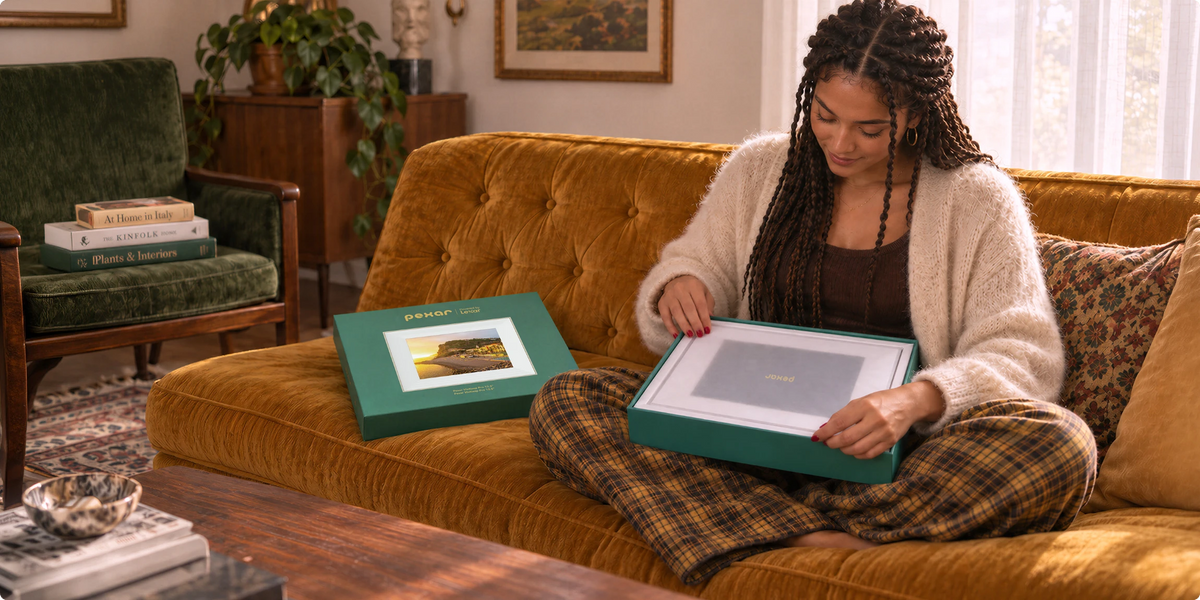 Woman on a velvet sofa unboxing a Pexar VivKeep Pro 12.5 as a gift to herself