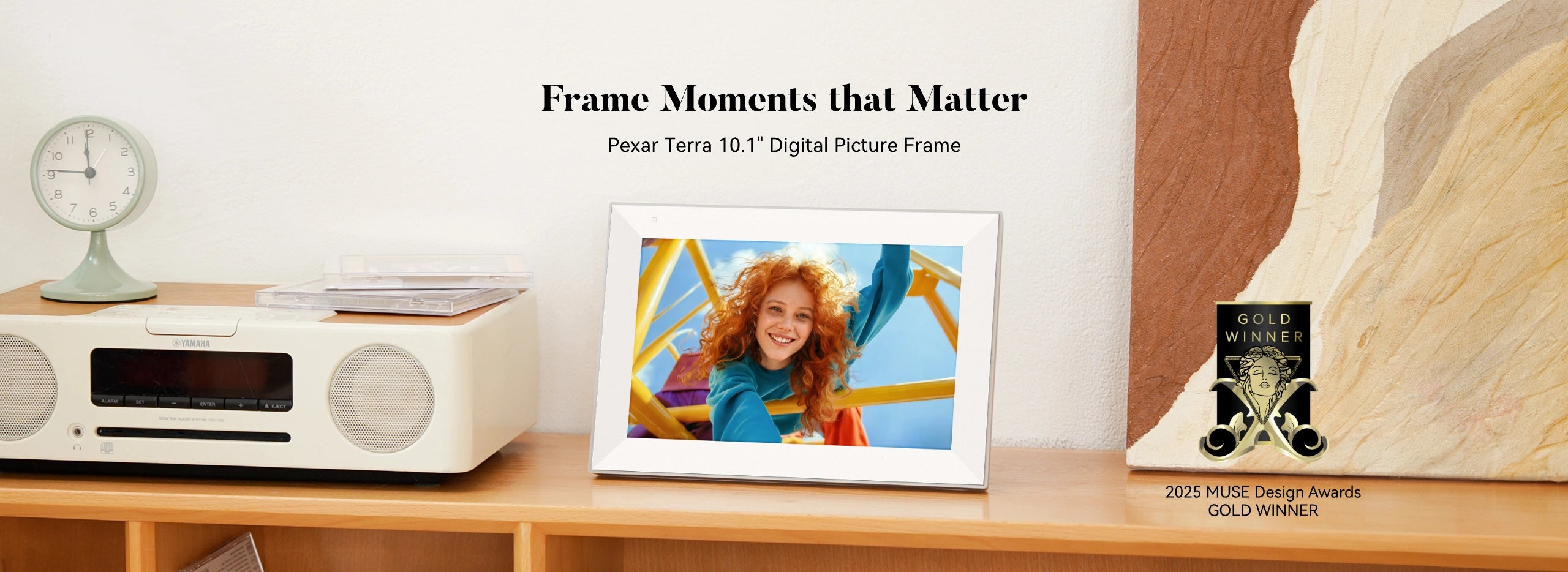 pexar Digital photo frame on a shelf with decorative items and text about the product, pexar 2025 MUSE Design Awards GOLD WINNER