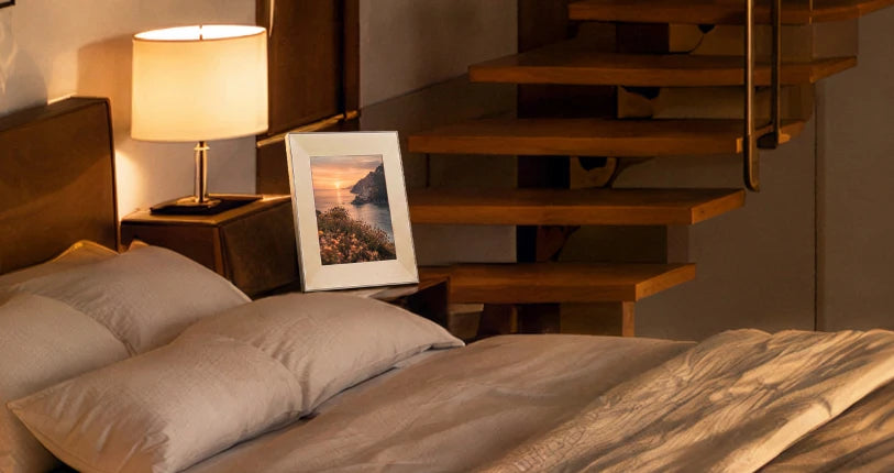 Frame on a bedside table beside a staircase