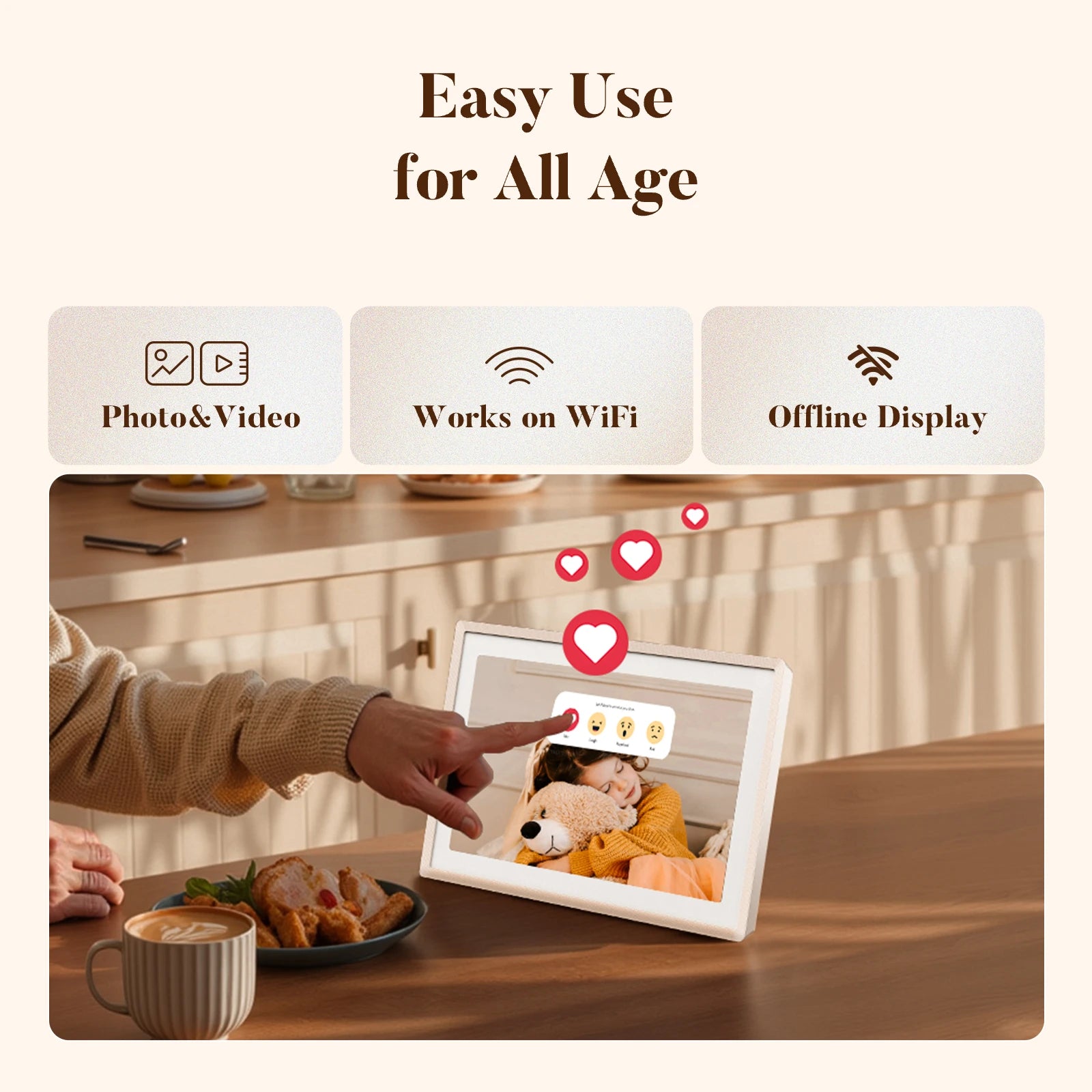 Hand tapping a sand 2K digital picture frame on a kitchen table showing a child hugging a teddy bear, with floating heart reactions
