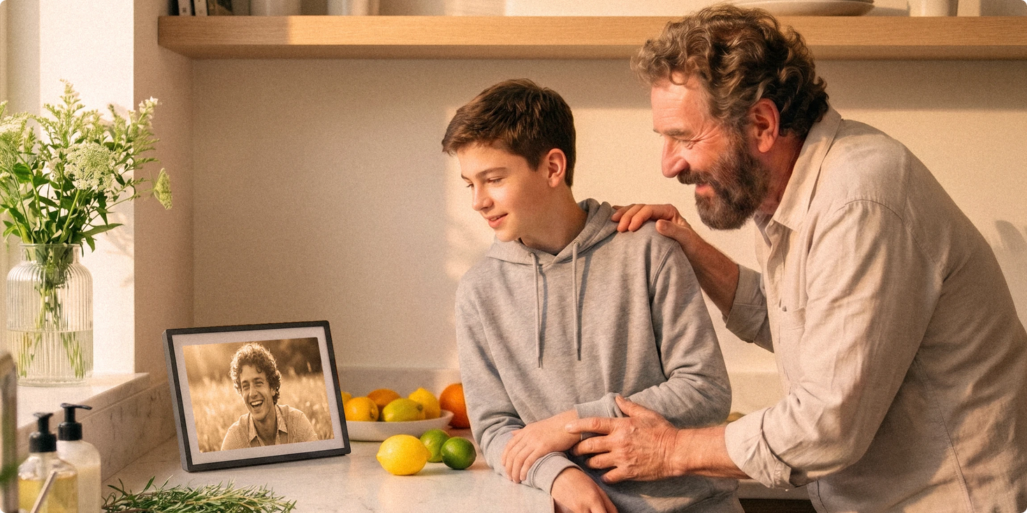 Dad and son looking at family photos on a Pexar anti-glare digital picture frame in the living room