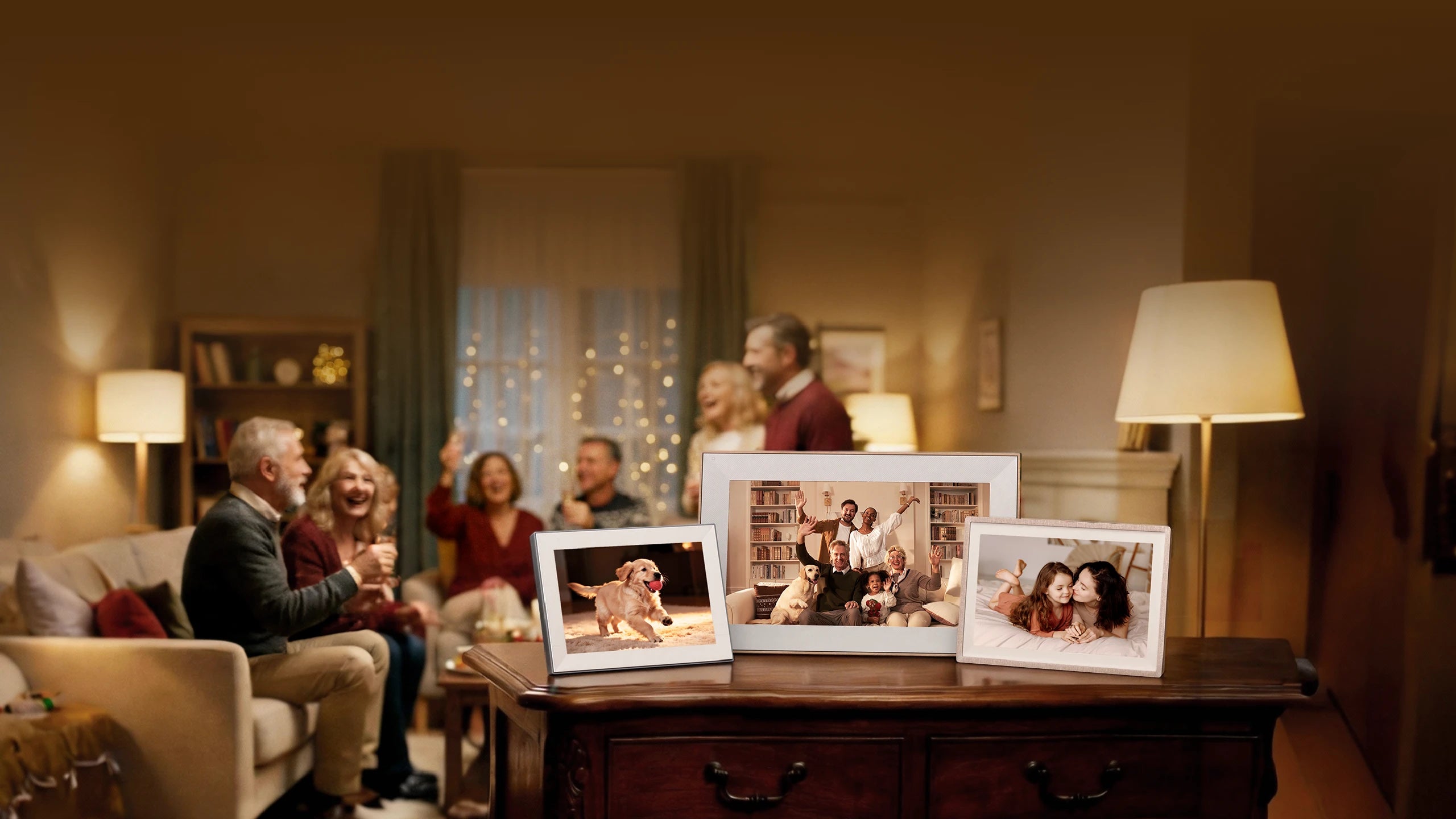 A warm, festive gathering of friends and family in a cozy, dimly lit living room, with three Pexar digital picture frames (powered by Lexar) displayed on a wooden table in the foreground. The frames show joyful photos of a dog, a multi-generational family, and two children, emphasizing how the devices preserve and share precious moments while enhancing the warm, connected atmosphere of the celebration.